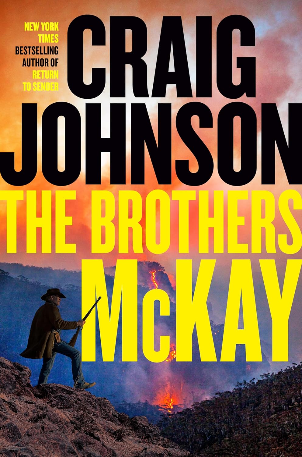 Book cover for the Longmire mystery "The Brothers McKay" by Craig Johnson. The design features a dramatic, cinematic image of the rugged Wyoming wilderness, capturing a tense rural atmosphere with hints of an encroaching wildfire under a smoky sky. The author's name, Craig Johnson, is featured prominently across the top in a bold, weathered font, with the title "The Brothers McKay" written cleanly across the lower center.