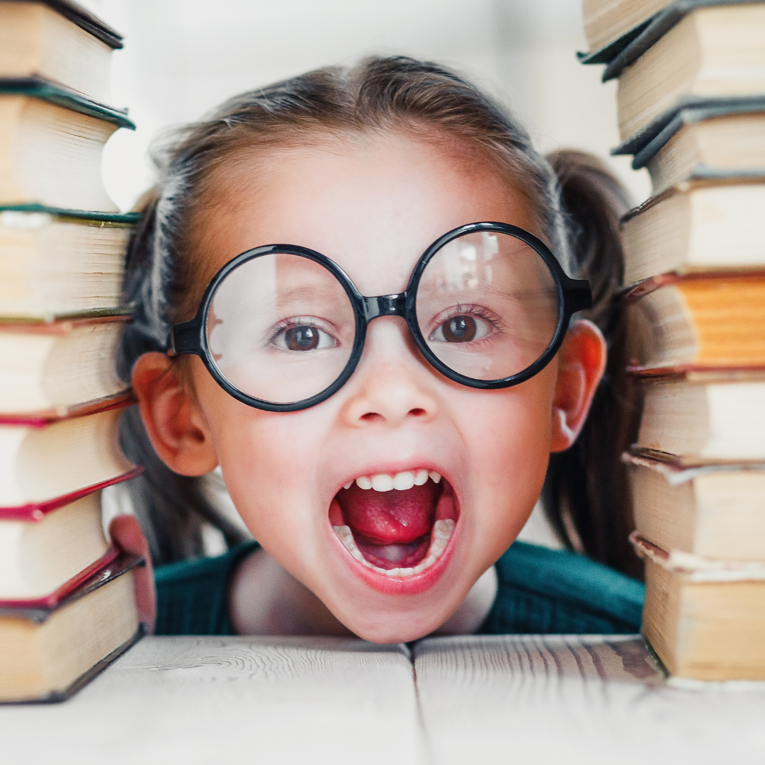 kid with glass & book Website photo